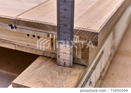Joinery. Door leaf measure with a ruler. Wood door manufacturing process. Furniture manufacture Joinery. Door leaf measure with a ruler. Wood door manufacturing process. Furniture manufacture 73450104