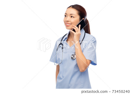 asian female doctor or nurse calling on smartphone 73450240