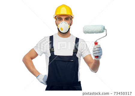 worker or builder in respirator with paint roller 73450317