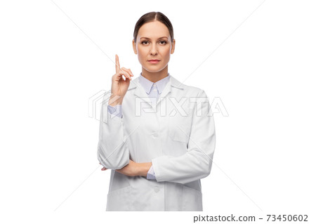 female doctor pointing finger up female doctor pointing finger up 73450602