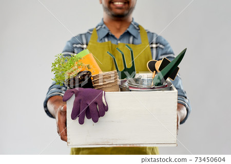 indian gardener or farmer with box of garden tools 73450604