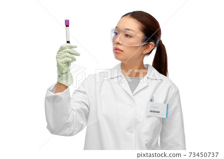 asian female doctor holding beaker with blood test 73450737