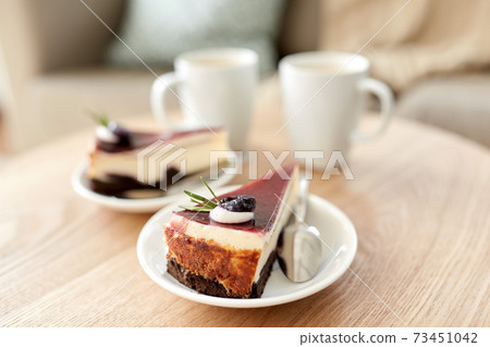 piece of chocolate cake on wooden table piece of chocolate cake on wooden table 73451042