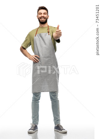 happy smiling barman in apron showing thumbs up 73451201