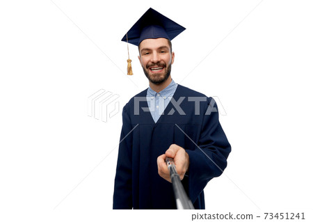 male graduate student taking selfie with monopod male graduate student taking selfie with monopod 73451241