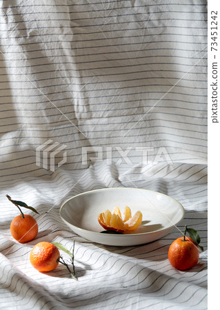 still life with mandarins on plate over drapery still life with mandarins on plate over drapery 73451242