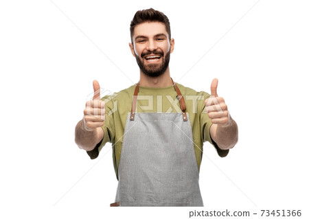 happy smiling barman in apron showing thumbs up happy smiling barman in apron showing thumbs up 73451366