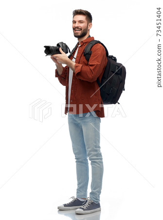 happy man or photographer with camera and backpack happy man or photographer with camera and backpack 73451404