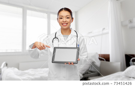asian female doctor with tablet pc at hospital 73451426