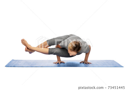 woman making yoga in handstand on mat woman making yoga in handstand on mat 73451445