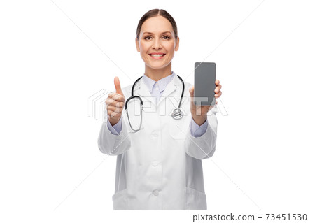 female doctor with smartphone showing thumbs up female doctor with smartphone showing thumbs up 73451530