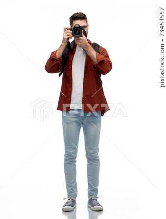 smiling man or photographer with digital camera smiling man or photographer with digital camera 73451557