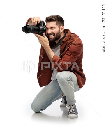 smiling man or photographer with digital camera 73451566