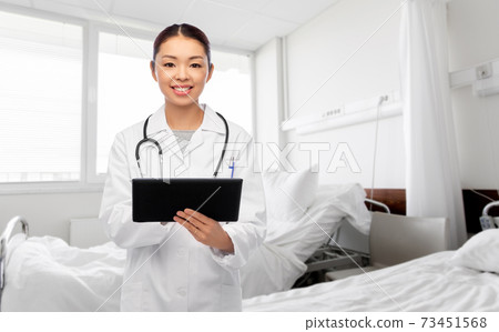 asian female doctor with tablet pc at hospital asian female doctor with tablet pc at hospital 73451568