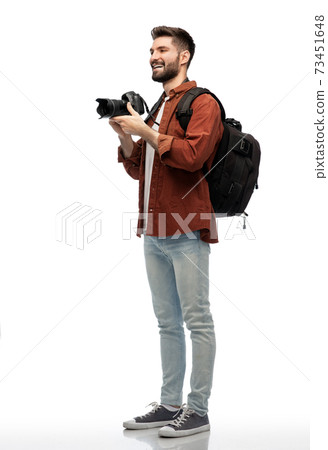 happy man or photographer with camera and backpack 73451648