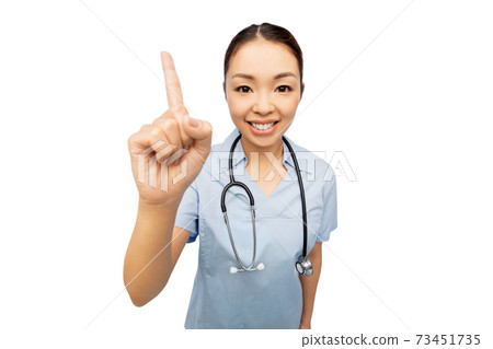 happy asian female doctor pointing finger up happy asian female doctor pointing finger up 73451735