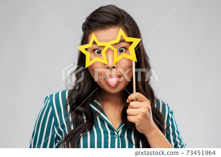 happy asian woman with star-shaped party glasses happy asian woman with star-shaped party glasses 73451964
