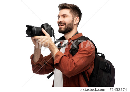 happy man or photographer with camera and backpack 73452274