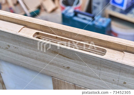 Joinery. Door leaf. Door lock installation. Wood door manufacturing process. Furniture manufacture Joinery. Door leaf. Door lock installation. Wood door manufacturing process. Furniture manufacture 73452305