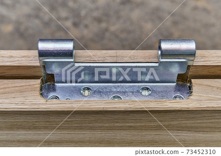 Joinery. Door leaf. Door hinge installation. Wood door manufacturing process. Furniture manufacture 73452310