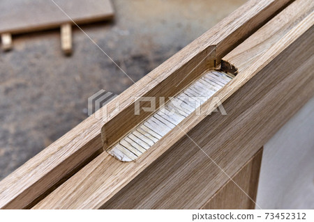 Joinery. Door leaf. Wood door manufacturing process. Furniture manufacture Joinery. Door leaf. Wood door manufacturing process. Furniture manufacture 73452312