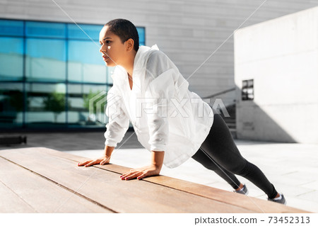 african american woman doing sports outdoors 73452313