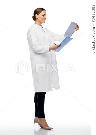happy smiling female doctor with clipboard happy smiling female doctor with clipboard 73452392