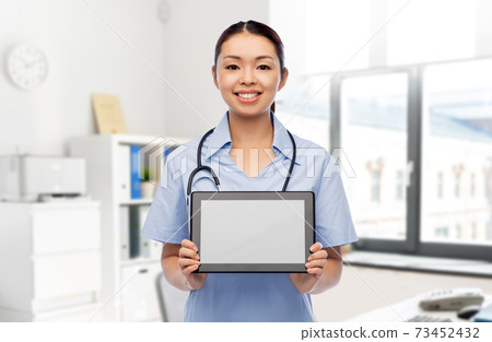 asian female doctor with tablet pc at hospital asian female doctor with tablet pc at hospital 73452432