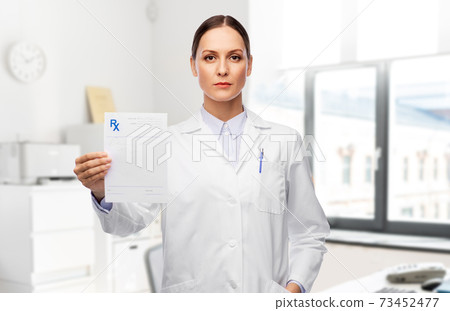 female doctor with prescription blank female doctor with prescription blank 73452477