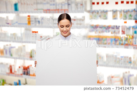 happy smiling female pharmacist with white board 73452479