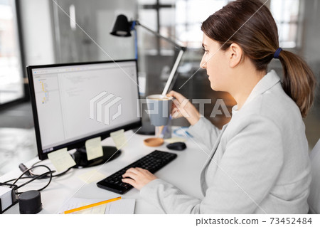 businesswoman with computer and coffee at office businesswoman with computer and coffee at office 73452484
