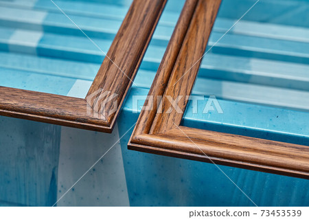 Joinery. Wood door manufacturing process. Wooden moldings for entrance door. Furniture manufacture 73453539