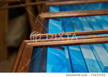 Joinery. Wood door manufacturing process. Wooden moldings for entrance door. Furniture manufacture Joinery. Wood door manufacturing process. Wooden moldings for entrance door. Furniture manufacture 73453542