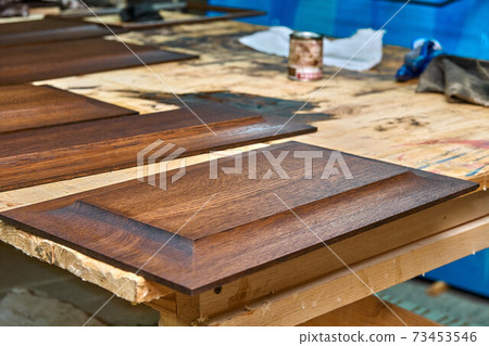 Joinery. Wood panels for entrance door. Wood door manufacturing process. Furniture manufacture 73453546