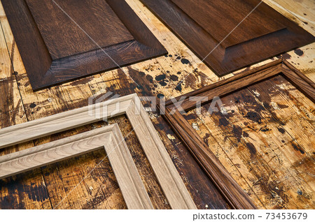 Joinery. Wood panels and moldings for entrance door. Wood door manufacturing process. Furniture manufacture Joinery. Wood panels and moldings for entrance door. Wood door manufacturing process. Furniture manufacture 73453679