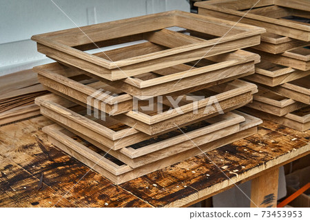 Joinery. Wooden moldings for entrance door. Wood door manufacturing process. Furniture manufacture Joinery. Wooden moldings for entrance door. Wood door manufacturing process. Furniture manufacture 73453953