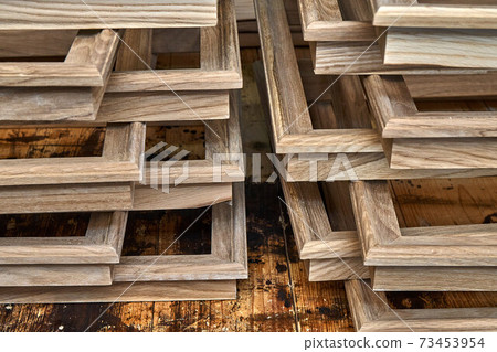 Joinery. Wooden moldings for entrance door. Wood door manufacturing process. Furniture manufacture 73453954