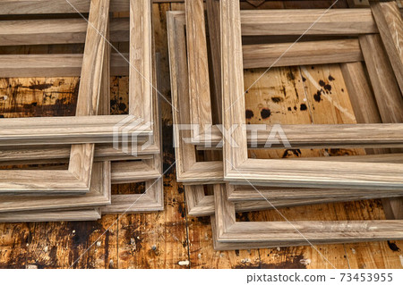 Joinery. Wooden moldings for entrance door. Wood door manufacturing process. Furniture manufacture 73453955