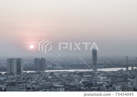 Aerial view of Amazing beautiful scenery view of Bangkok City skyline and skyscraper before sun setting. 73454045