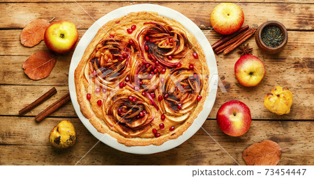 Apple pie on a wooden background Apple pie on a wooden background 73454447
