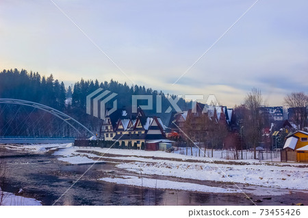 Spectacular view to the Tatra mountains from the car bridge. Zakopane, Poland Spectacular view to the Tatra mountains from the car bridge. Zakopane, Poland 73455426