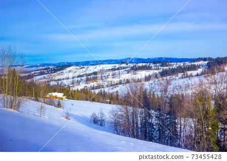 Wooden chalet in winter in Zakopane - Tatra Mountains Wooden chalet in winter in Zakopane - Tatra Mountains 73455428