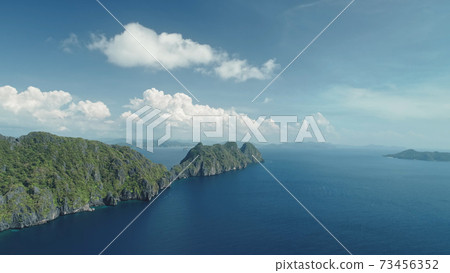 Hilly islands at blue ocean coast aerial view. Nobody nature of Palawan, El Nido Isles, Philippines Hilly islands at blue ocean coast aerial view. Nobody nature of Palawan, El Nido Isles, Philippines 73456352