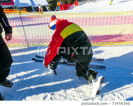 People resting at Tatranska Lomnica, the popular ski resort in High Tatras People resting at Tatranska Lomnica, the popular ski resort in High Tatras 73456398