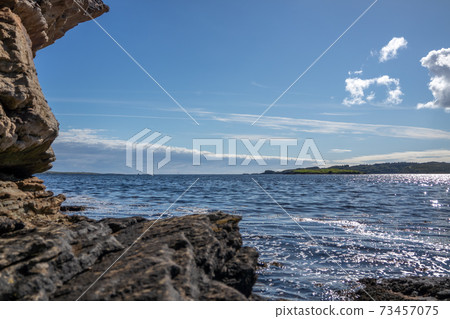 Stones close to the pier in Bruckless in County Donegal - Ireland. Stones close to the pier in Bruckless in County Donegal - Ireland. 73457075