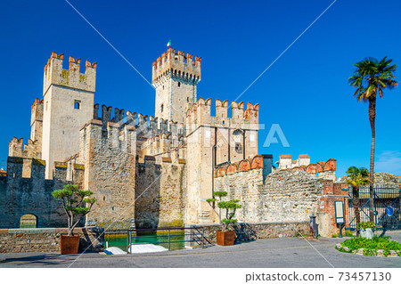 Scaligero Castle Castello di Sirmione fortress from Scaliger era in historical center of Sirmione town on Garda lake, medieval castle with stone towers and brick walls, Lombardy, Northern Italy 73457130