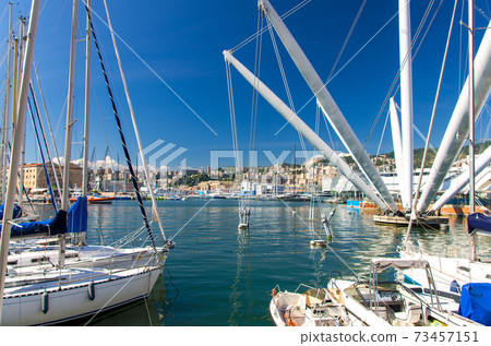 Port Porto Antico harbor with luxury white yachts and attractions, Bigo construction in historical centre of old european city Genoa Port Porto Antico harbor with luxury white yachts and attractions, Bigo construction in historical centre of old european city Genoa 73457151