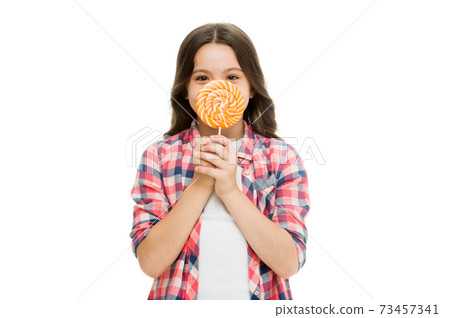 Food addictions. Girl kid eat sweet lollipop. Happy childhood. Sugar Food addictions. Girl kid eat sweet lollipop. Happy childhood. Sugar 73457341