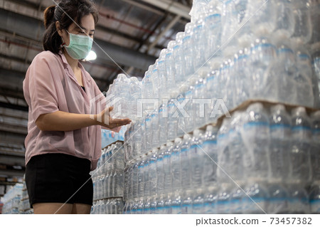 Female people choosing fresh water in plastic bottles packaged,good quality of mineral water,asian woman buying drinking water in supermarket,shopping for beverage,essential nutrition food for life Female people choosing fresh water in plastic bottles packaged,good quality of mineral water,asian woman buying drinking water in supermarket,shopping for beverage,essential nutrition food for life 73457382