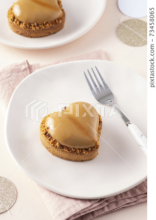 Heart shape vanilla tart with nuts. Valentine's Day. Heart shape vanilla tart with nuts. Valentine's Day. 73458065